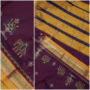 Maroon with mustard border and pallu silk cotton kasuti embroidered Ilkal with Anne ambari  motif and traditional tope teni pallu . 