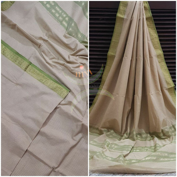 Beige cotton blended checks with contrasting green border and striped pallu.