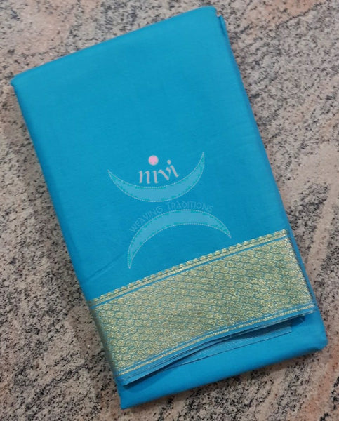 Blue cotton blended saree with zari border and thin zari stripes on pallu.