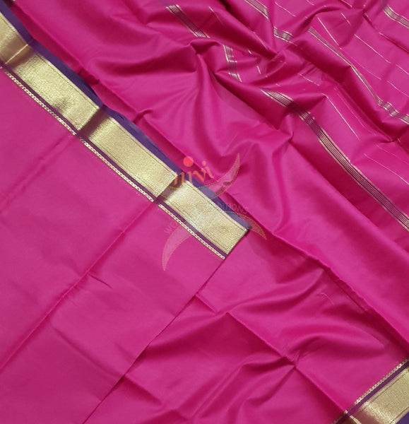 Fuschia pink cotton blended with zari border and zari stripes pallu.