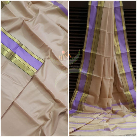 Beige cotton blend saree with contrasting purple border and thin stripes on pallu.