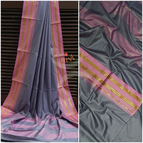 Grey checks art silk blend with contrasting pink border and thin stripes on pallu.