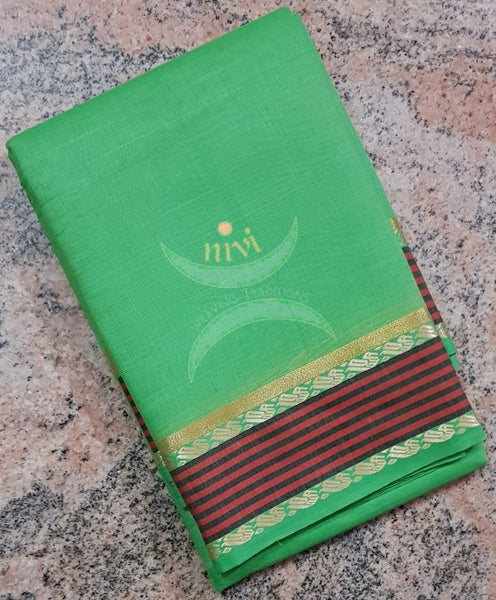 Green cotton blend with contrasting maroon border and striped pallu.