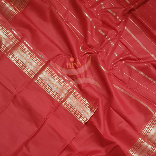 Red cotton blend saree with subtle gold zari border and thin stripes on pallu