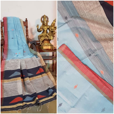 Aqua blue Handloom linen with woven buttis on body, Ganga Jamuna border of orange and beige colour and woven geecha pallu.  Saree comes with contrasting Grey shot with navy blue blouse.