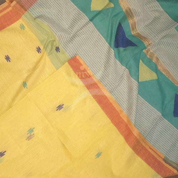 Pastel yellow  Handloom linen  with woven buttis on body, border of orange colour and woven geecha pallu.  Saree comes with contrasting blue green blouse.