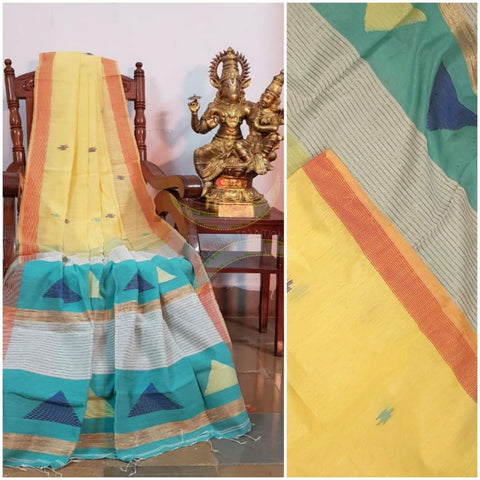 Pastel yellow  Handloom linen  with woven buttis on body, border of orange colour and woven geecha pallu.  Saree comes with contrasting blue green blouse.