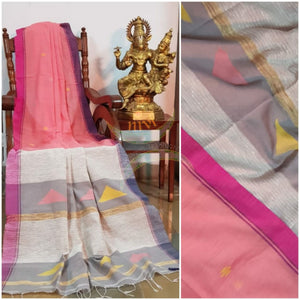 Peach  Handloom linen with woven buttis on body, Ganga jamuna border of fuschia and purple colour and woven geecha pallu.  Saree comes with contrasting grey blouse.