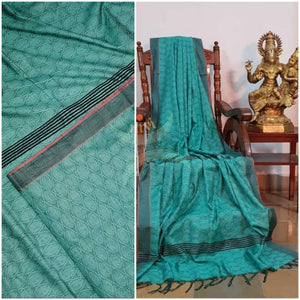 Sea green Bengal handloom cotton tussar with all over jacquard weaving. Saree comes with running blouse.