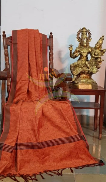 Brick orange Bengal handloom cotton tussar with all over jacquard weaving. Saree comes with running blouse.