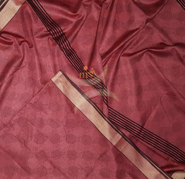 Maroon Bengal handloom cotton tussar with all over jacquard weaving. Saree comes with running blouse.