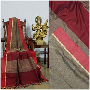 Brown handloom cotton with contrasting maroon shot with pink border and striped pallu. Saree comes with contrasting maroon blouse piece