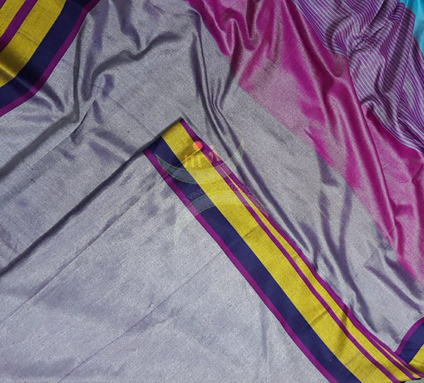 Grey shot with pink handloom linen with contrasting border and pallu. Saree comes with contrasting pink blouse piece.