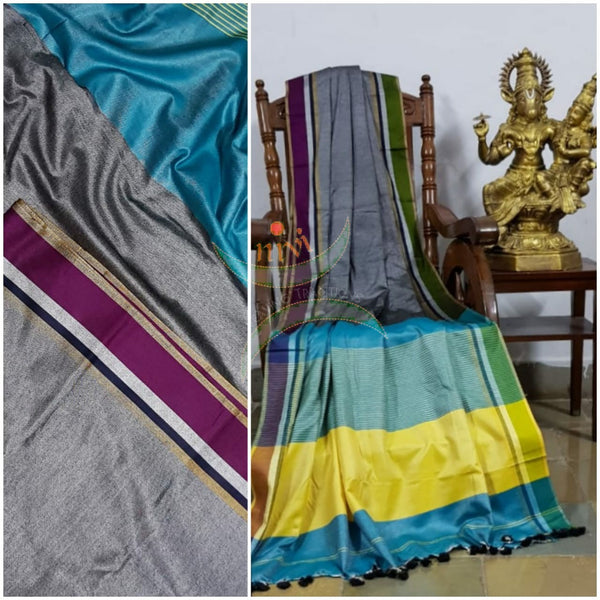 Grey handloom linen with contrasting ganga jamuna border and pallu. Saree comes with contrasting blue blouse piece.