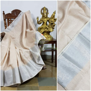 Beige handloom linen with subtle silver border and silver strips on pallu.