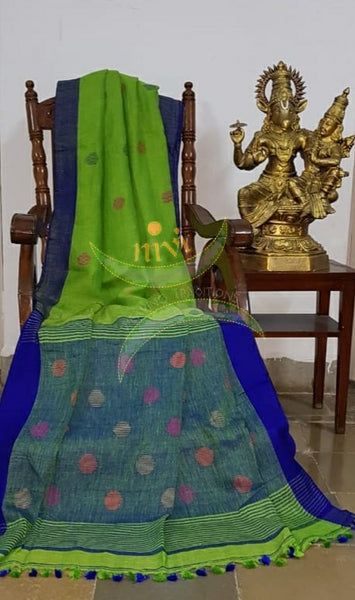 Lime green handloom linen with polka dots and contrasting Royal blue border, pallu and blouse.
