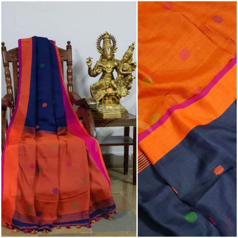Royal blue handloom linen with polka dots and contrasting orange border, pallu and blouse.