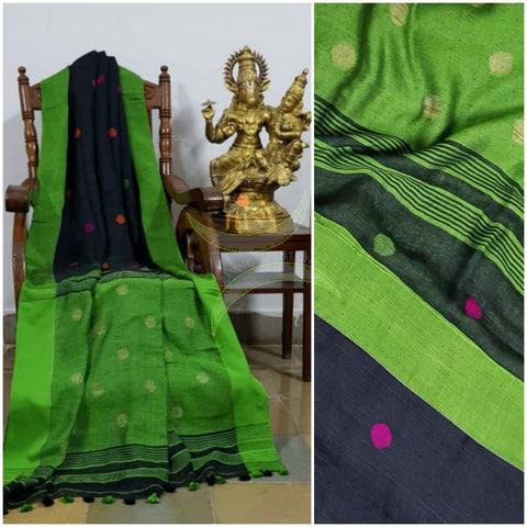 Black handloom linen with polka dots and contrasting lime green border, pallu and blouse.