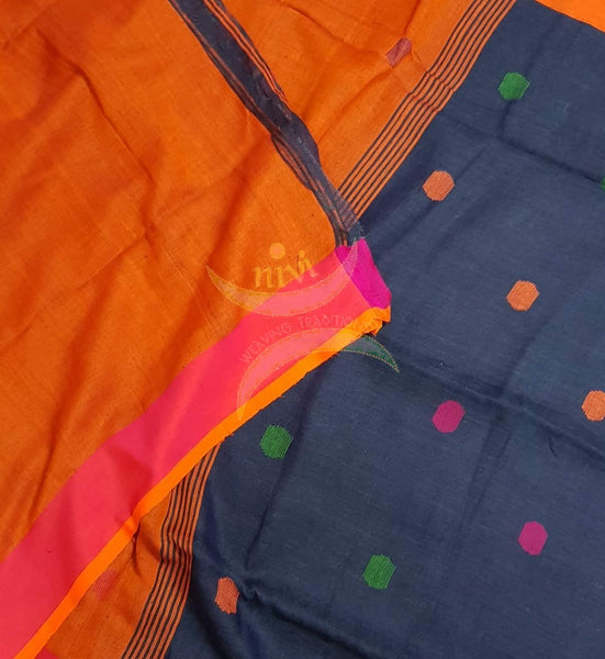 Royal blue handloom linen with polka dots and contrasting orange border, pallu and blouse.