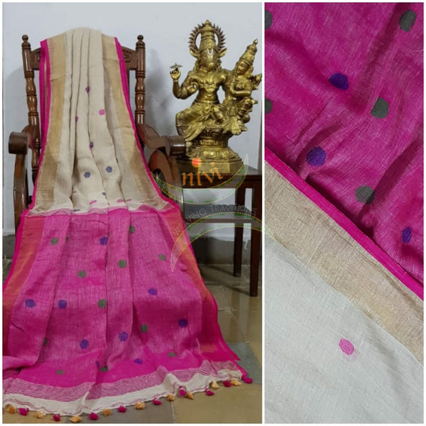 Cream handloom linen with polka dots and contrasting fuschia pink border, pallu and blouse.