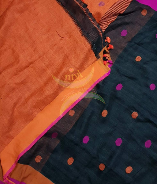 Black handloom linen with polka dots and Ganga jamuna border, contrasting orange pallu and blouse.