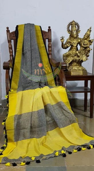 Grey 80s count pure handloom linen with contrasting yellow border, pallu and blouse.