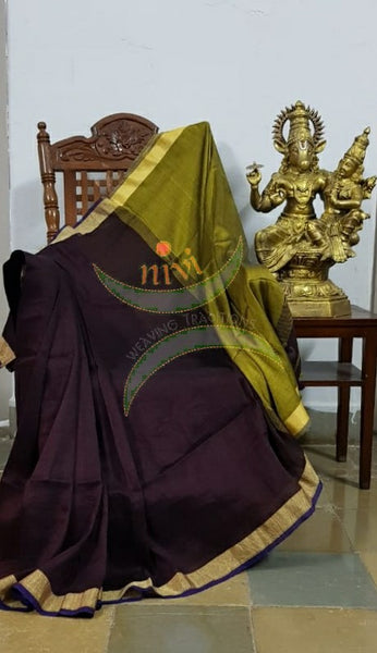 Chocolate brown 80s count pure handloom linen with contrasting green border, pallu and blouse.