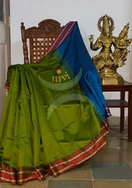 Green Bengal handloom cotton blend with temple border and contrasting Royal blue pallu  and blouse.