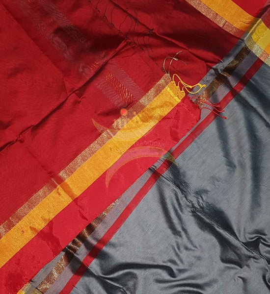 Grey Bengal handloom cotton blend with multi coloured border and contrasting red pallu and blouse.