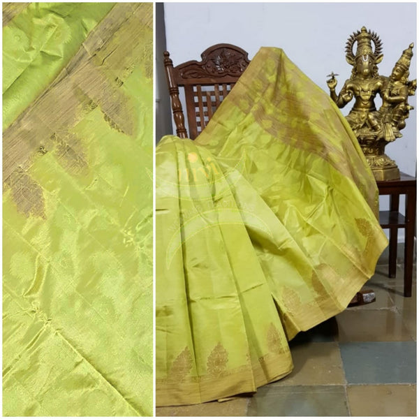 Lemon yellow art silk tussar with zari motif on pallu and border. Saree comes with running blouse piece