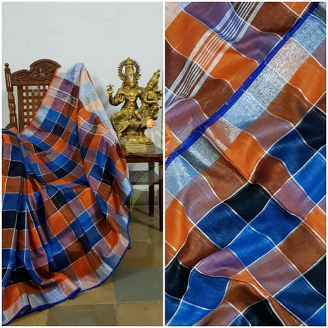Multi coloured checkered linen with subtle silver border and strips on pallu. Sarees comes with running blouse.