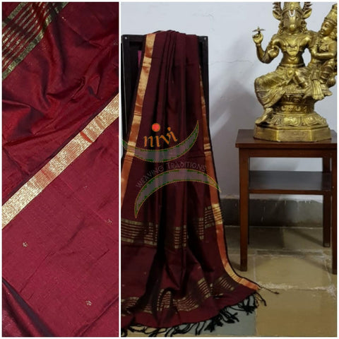 Maroon handloom dupatta with subtle gold borders and buttis all over the body.