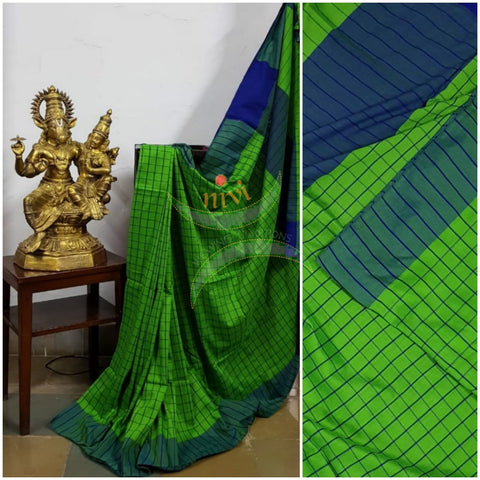 Green handloom gamacha cotton with contrasting blue border and blouse.