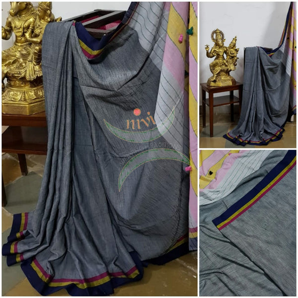 Grey handloom cotton with contrasting multicoloured border, pompoms on pallu  and running blouse.