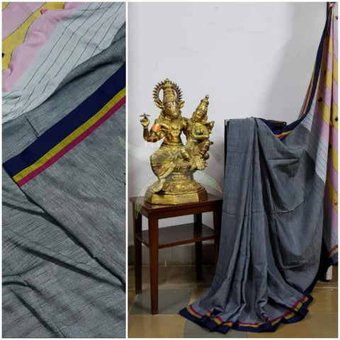 Grey handloom cotton with contrasting multicoloured border, pompoms on pallu  and running blouse.