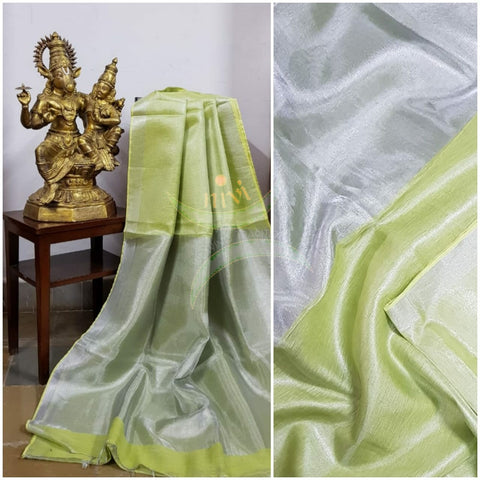 Light green handloom tissue linen with silverish grey border. The saree comes with running blouse.
