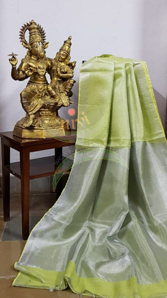 Light green handloom tissue linen with silverish grey border. The saree comes with running blouse.