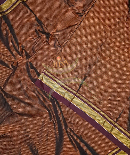 Brown Khun/khana running material with maroon border. Width of the fabric is 29 inches.