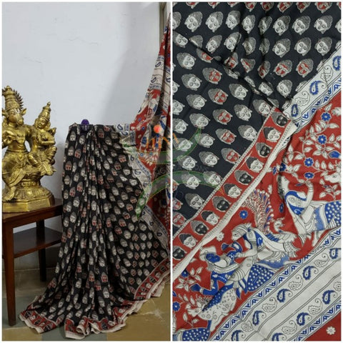 Black handloom chennur silk kalamkari with Buddha face motif on body and mythological human motif on pallu. The Saree comes with kalamkari printed blouse piece.