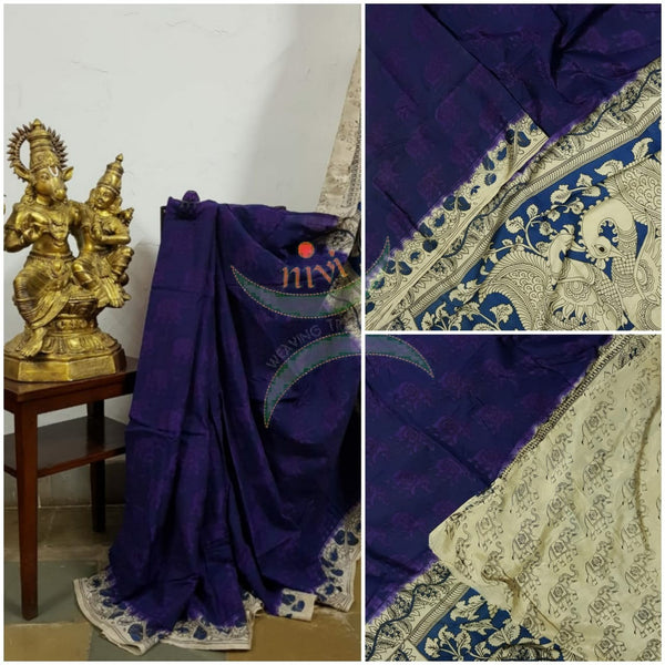Royal blue handloom chennur silk kalamkari with purple elephant motif on body and peacock motif on pallu. The Saree comes with kalamkari printed blouse piece.