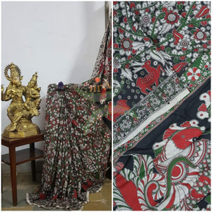 Black handloom chennur silk kalamkari with floral motif on body and peacock motif on pallu. The Saree comes with kalamkari printed blouse piece.