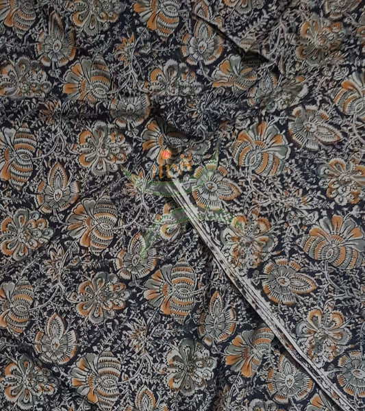 Brown handloom cotton kalamkari fabric with floral motif.