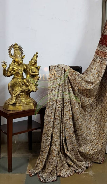 Cream handloom venkatagiri cotton kalamkari Saree with all over paisley motif. The Saree comes with running blouse piece.
