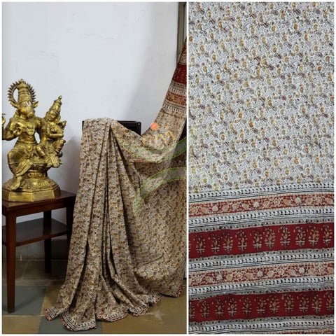 Cream handloom venkatagiri cotton kalamkari Saree with all over paisley motif. The Saree comes with running blouse piece.