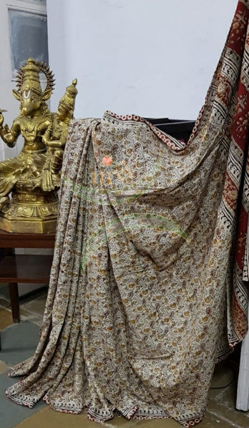 Cream handloom venkatagiri cotton kalamkari Saree with all over paisley motif. The Saree comes with running blouse piece.