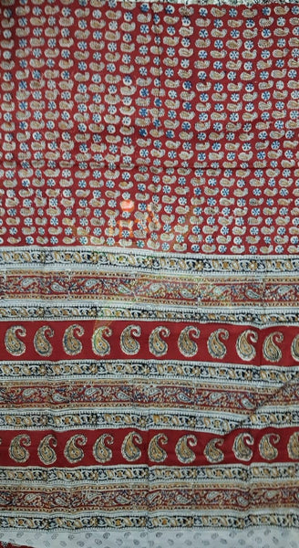 Red handloom venkatagiri cotton kalamkari saree with all over paisley motifs. The Saree comes with kalamkari printed blouse piece.