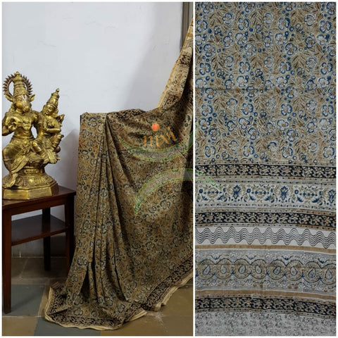 Mustard yellow handloom venkatagiri cotton kalamkari saree with all over floral motifs. The Saree comes with kalamkari printed blouse piece.