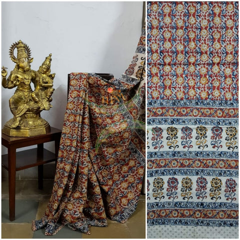 Red handloom venkatagiri cotton kalamkari Saree with all over floral motif. The Saree comes with kalamkari printed blouse piece.