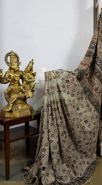 Cream handloom venkatagiri cotton kalamkari saree with all over floral motifs. The Saree comes with kalamkari printed blouse piece.