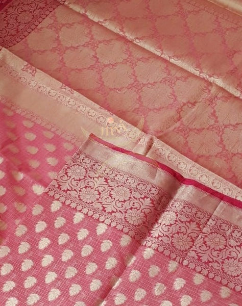 Pink silk cotton benaras brocade with fuschia pink border, antique zari  butties on body, pallu and border. The saree comes with brocade blouse piece.